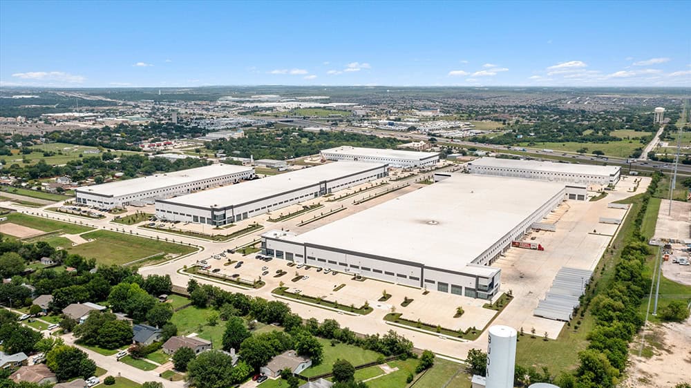 Aerial view of Buda Warehouse industrial park with large storage buildings.